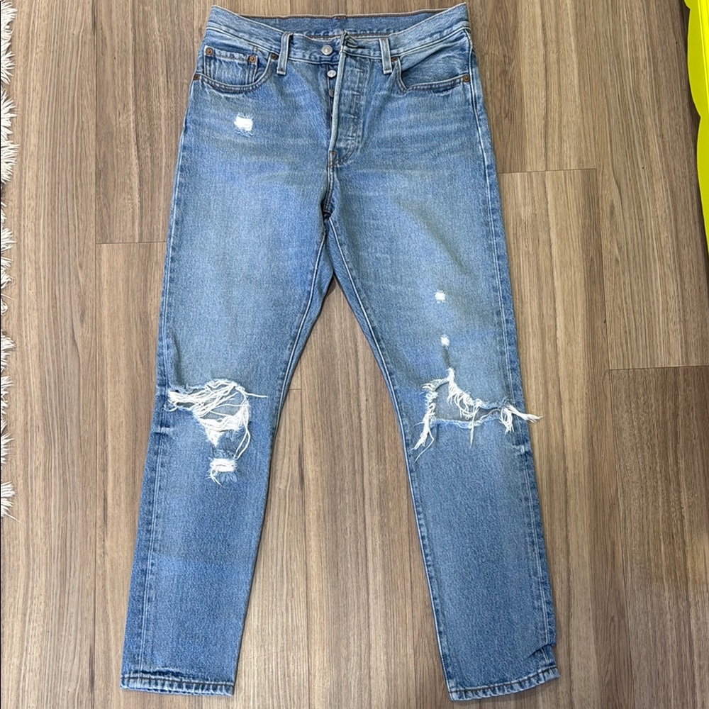 Levi 501 distressed blue jeans
